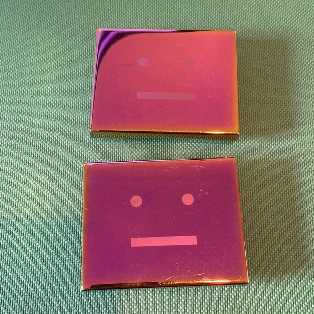 Acne Studios metal face shoe charms (pair)